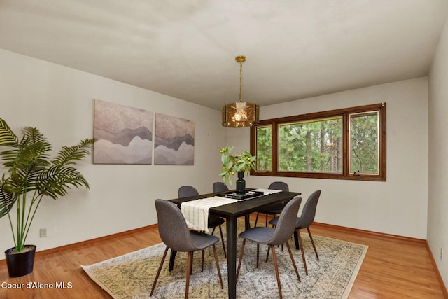 694 S Signal Point Rd, Post Falls, ID 83854 - dining area featuring a chandelier and light wood-style floors