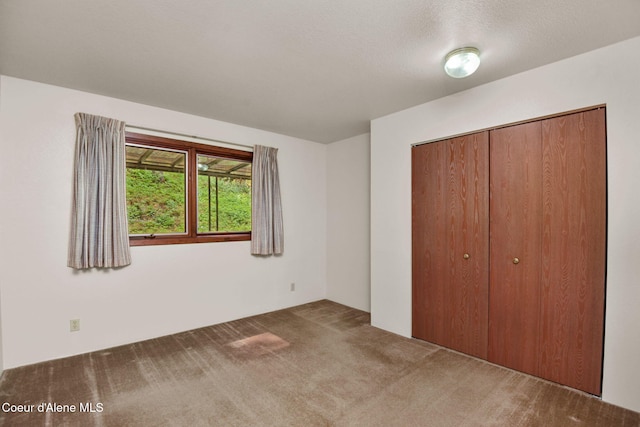 694 S Signal Point Rd, Post Falls, ID 83854 - unfurnished bedroom featuring carpet floors and a closet