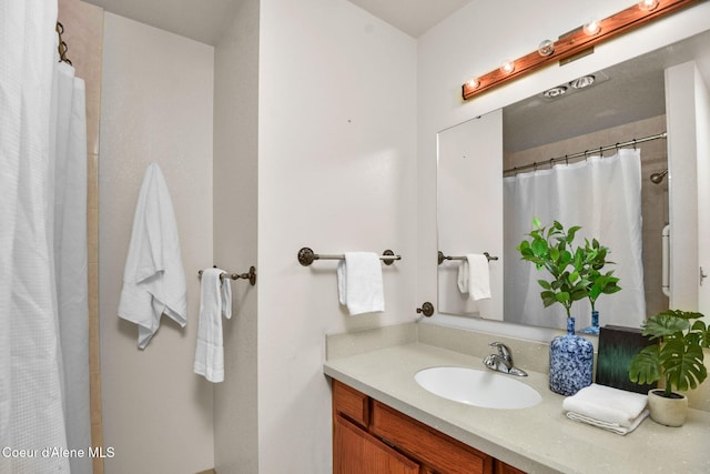694 S Signal Point Rd, Post Falls, ID 83854 - bathroom featuring vanity and curtained shower