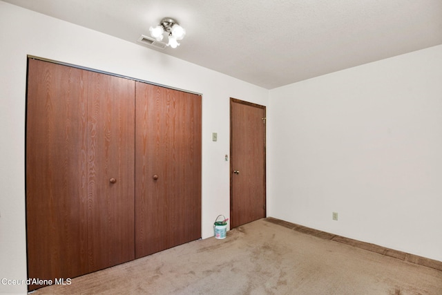 694 S Signal Point Rd, Post Falls, ID 83854 - unfurnished bedroom featuring carpet and a closet