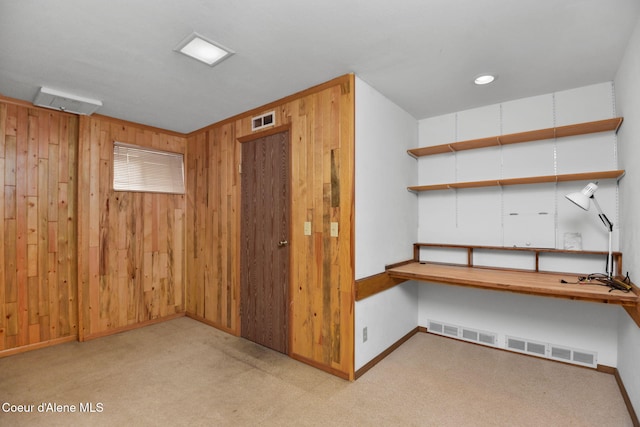 694 S Signal Point Rd, Post Falls, ID 83854 - unfurnished office with built in desk, wood walls, and carpet floors