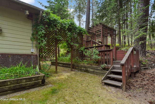 694 S Signal Point Rd, Post Falls, ID 83854 - view of grassy yard featuring a deck and stairs