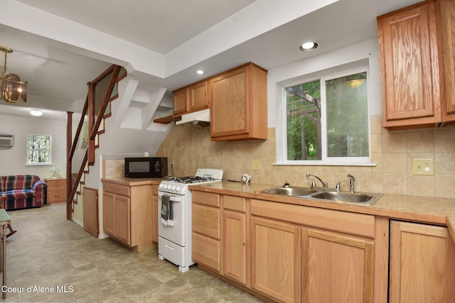 694 S Signal Point Rd, Post Falls, ID 83854 - kitchen featuring white gas range, black microwave, light countertops, decorative backsplash, and a wall mounted AC