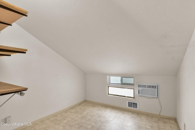 694 S Signal Point Rd, Post Falls, ID 83854 - bonus room featuring a wall mounted air conditioner, light flooring, and vaulted ceiling