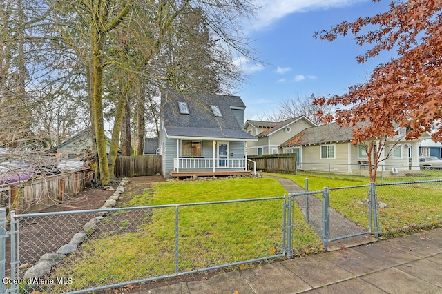 view of front of home with a front yard and covered porch