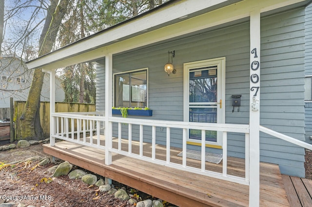 wooden terrace with a porch