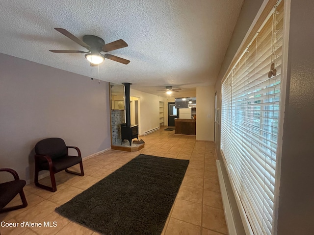 interior space featuring light tile patterned flooring and a textured ceiling