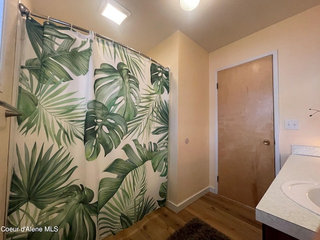 bathroom featuring vanity and wood-type flooring