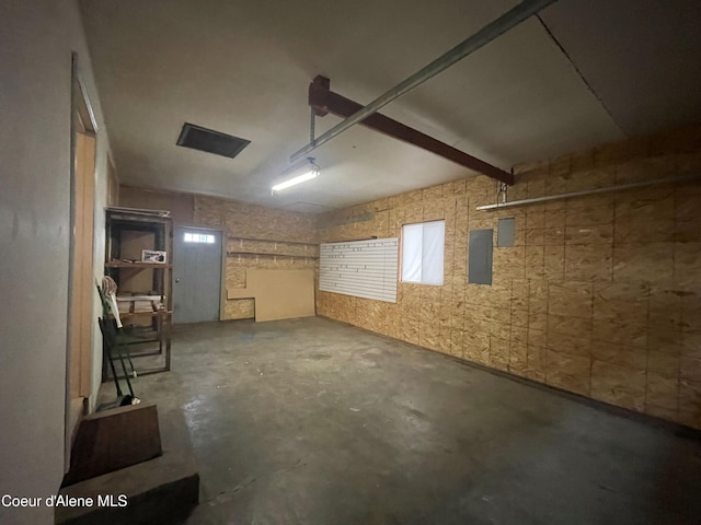 basement featuring electric panel