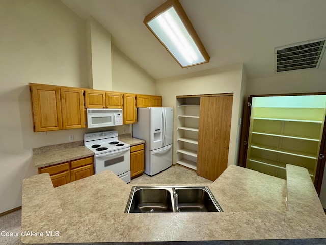 kitchen featuring light carpet, white appliances, high vaulted ceiling, and sink