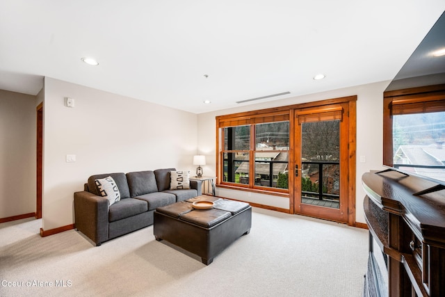 carpeted living room featuring a healthy amount of sunlight