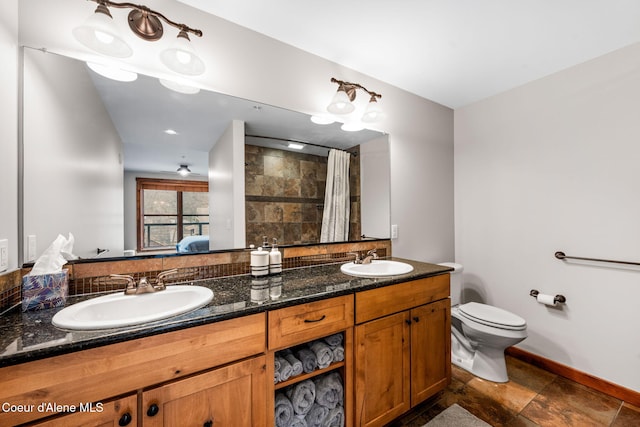 bathroom with a shower with curtain, vanity, and toilet