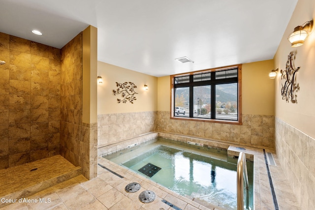 view of pool with an indoor in ground hot tub