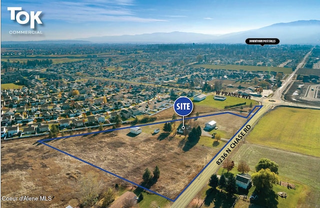 birds eye view of property featuring a mountain view