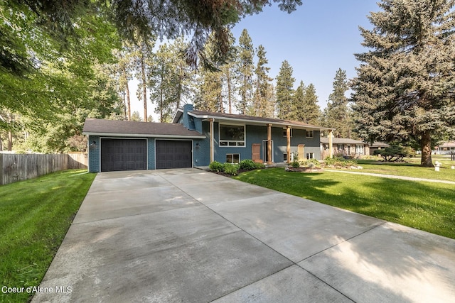 view of front of home with a garage and a front yard