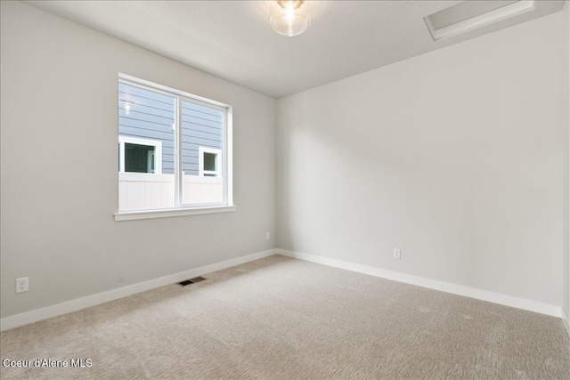 spare room featuring carpet flooring