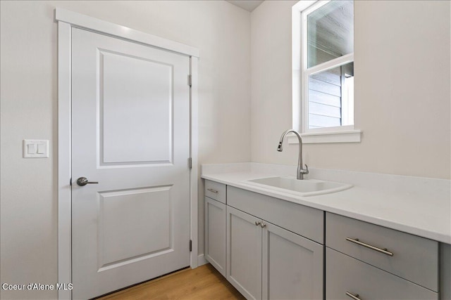 interior space with sink and light hardwood / wood-style flooring