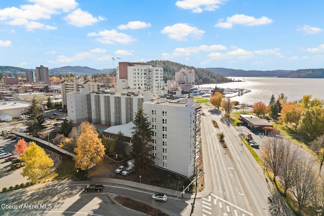 drone / aerial view with a water and mountain view