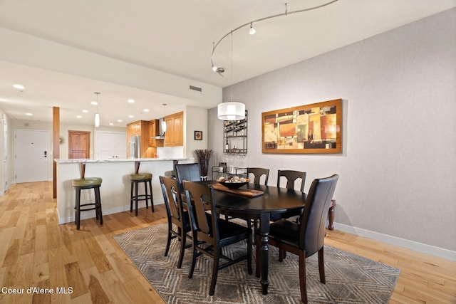 dining room featuring light wood-type flooring