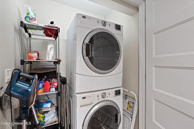 laundry room featuring stacked washer and dryer