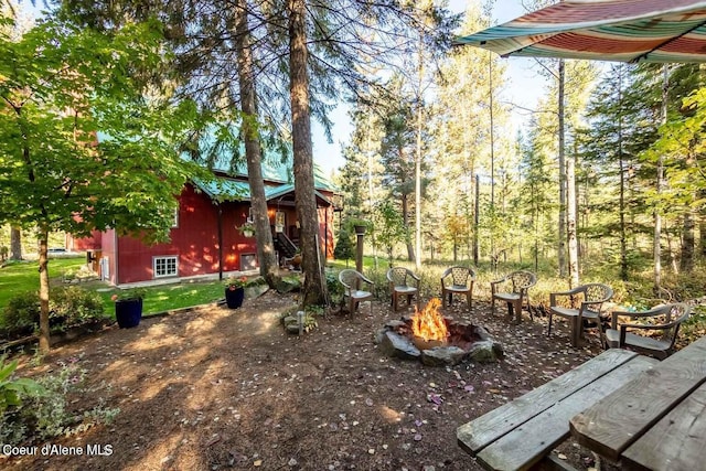 view of yard with an outdoor fire pit