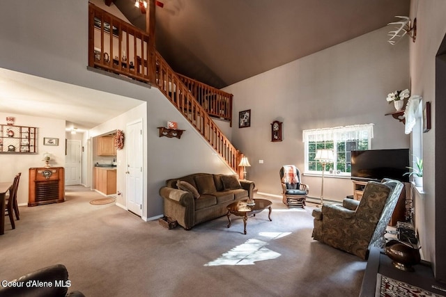 living room featuring carpet floors, high vaulted ceiling, and baseboard heating