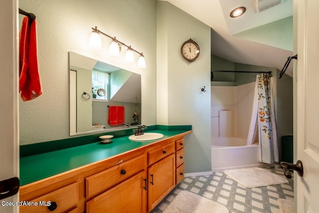 bathroom featuring shower / tub combo and vanity