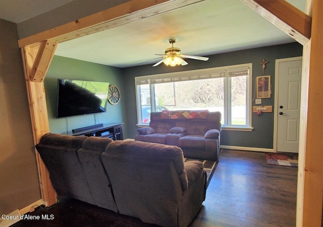 living room with dark hardwood / wood-style floors and ceiling fan