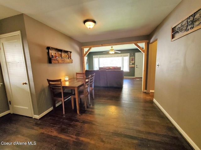 dining area with dark hardwood / wood-style flooring and ceiling fan