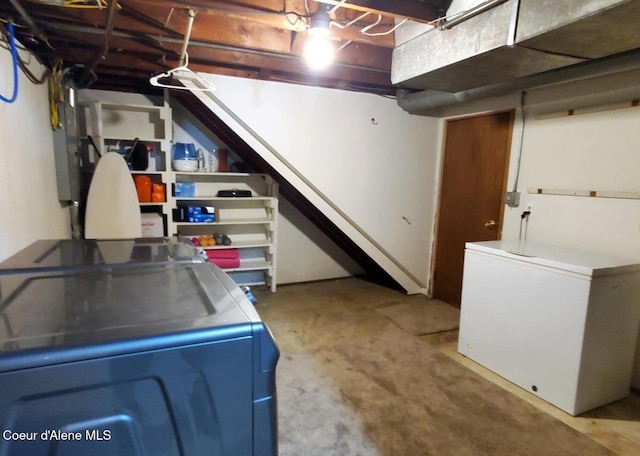 basement featuring washer / clothes dryer and refrigerator