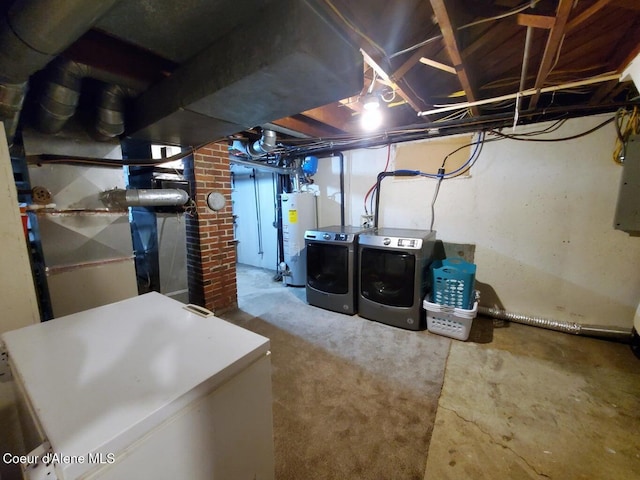 basement featuring water heater and washer and dryer