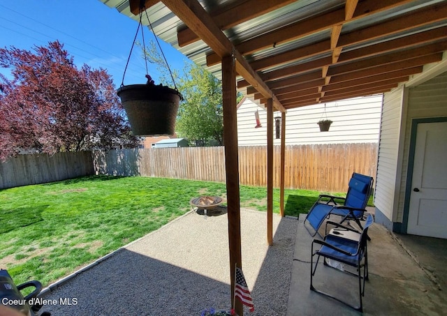 view of patio with an outdoor fire pit