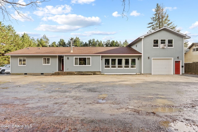 11673 N Boyer Rd, Sandpoint, ID 83864 - view of front of home with crawl space, driveway, a garage, and a shingled roof
