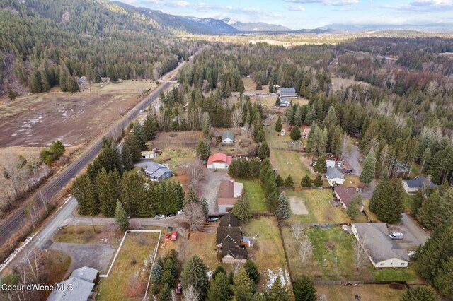 11673 N Boyer Rd, Sandpoint, ID 83864 - view of property location featuring a heavily wooded area and a mountain backdrop