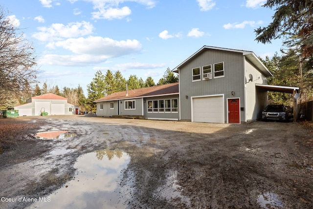 11673 N Boyer Rd, Sandpoint, ID 83864 - view of front of property with dirt driveway and a garage