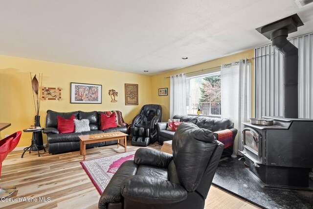 11673 N Boyer Rd, Sandpoint, ID 83864 - living area with a wood stove and wood finished floors