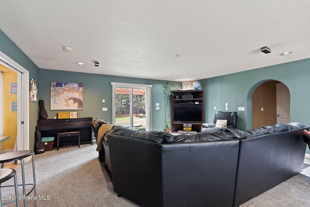11673 N Boyer Rd, Sandpoint, ID 83864 - living area featuring light carpet, recessed lighting, and arched walkways