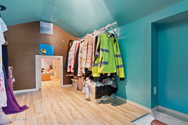 11673 N Boyer Rd, Sandpoint, ID 83864 - walk in closet with vaulted ceiling and wood finished floors