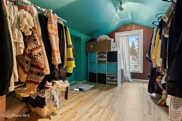 11673 N Boyer Rd, Sandpoint, ID 83864 - spacious closet featuring wood finished floors and vaulted ceiling
