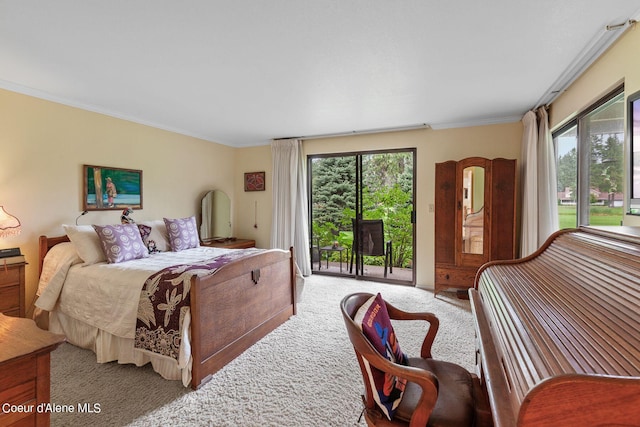 bedroom with carpet floors, crown molding, access to outside, and multiple windows