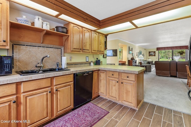 kitchen featuring tile counters, sink, dark hardwood / wood-style floors, kitchen peninsula, and black appliances