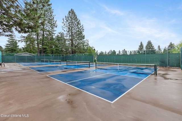 view of sport court with basketball hoop