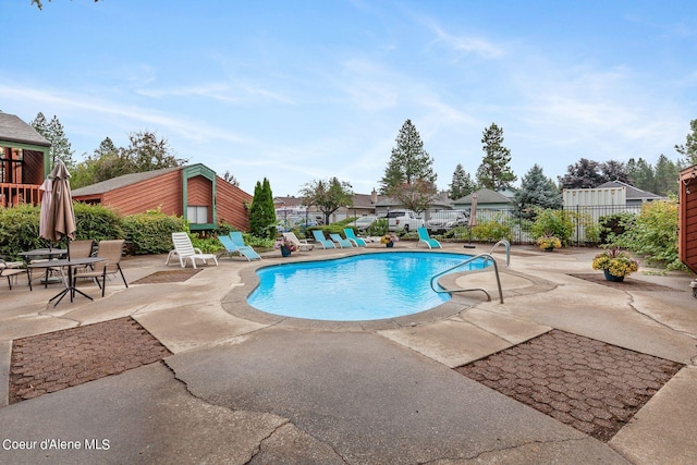 view of swimming pool featuring a patio