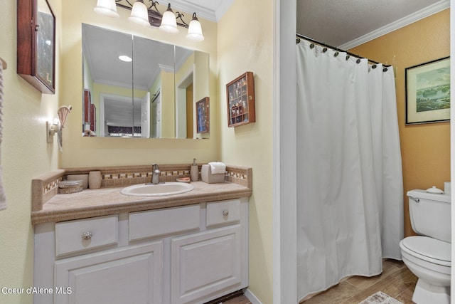 bathroom featuring vanity, toilet, wood-type flooring, and ornamental molding