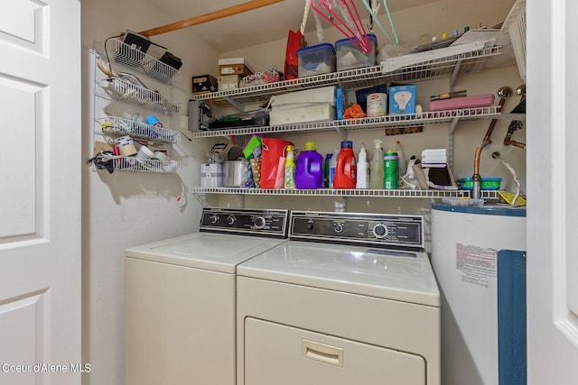 laundry area featuring washer and clothes dryer and water heater