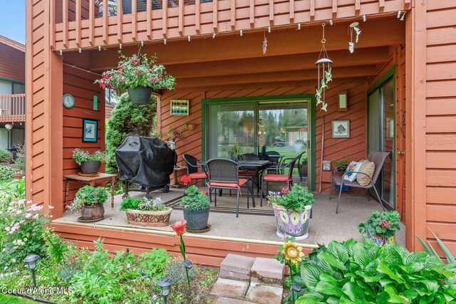 5299 W Green Ct # 5, Rathdrum, ID 83858 - wooden terrace with a grill and a patio area