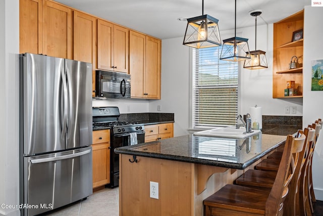 kitchen with hanging light fixtures, kitchen peninsula, a breakfast bar area, light tile patterned floors, and black appliances