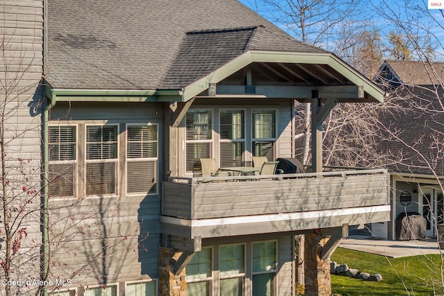 rear view of house featuring a balcony