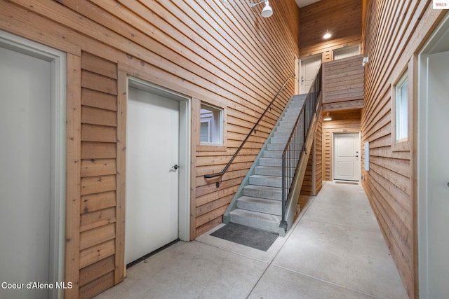 staircase with concrete floors