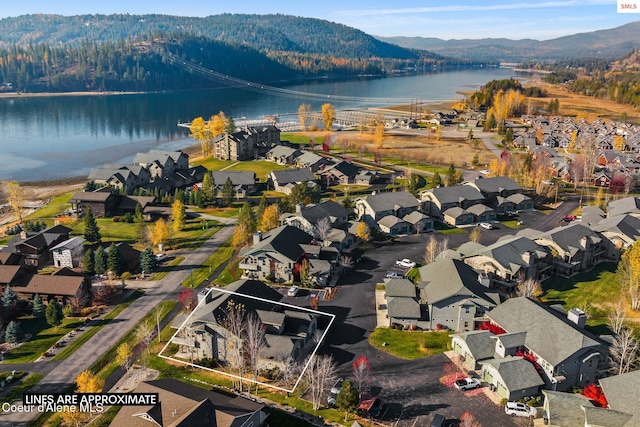 bird's eye view with a water and mountain view